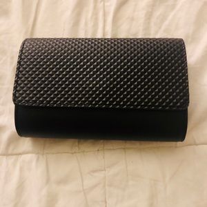 Black clutch with chain. Never been used!